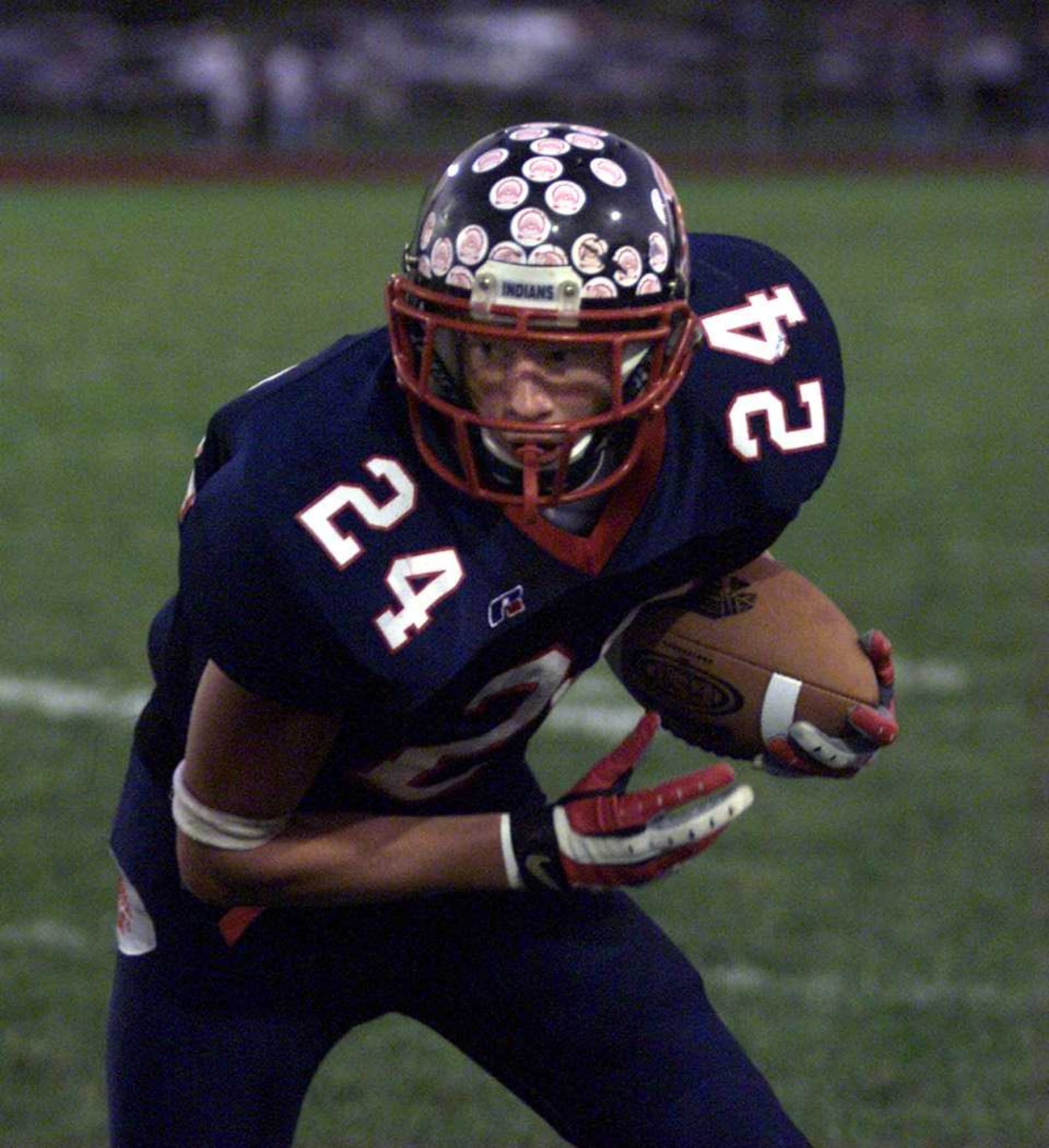 Piqua's Bryant Haines looks for open field after catching as pass vs. Butler in 2003. Jim Witmer/Staff