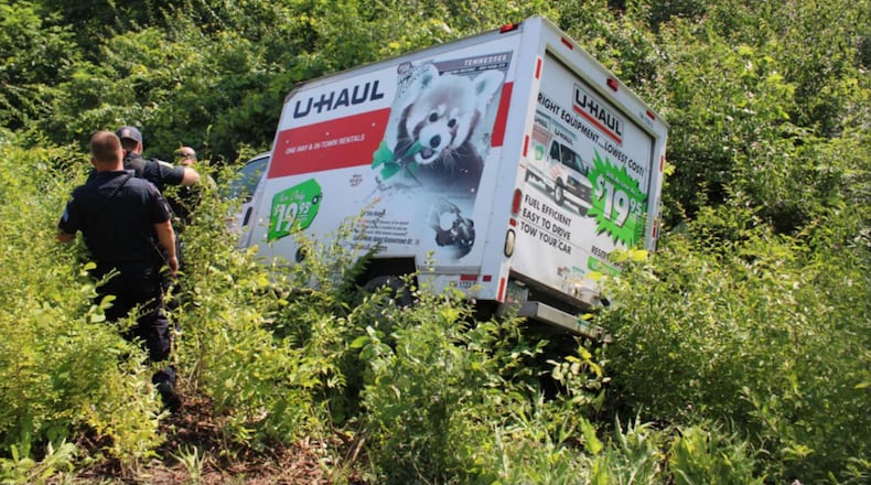A U-Haul truck reported stolen out of Riverside sits in brush after a police pursuit ended in a crash off of Interstate 75 near West Carrollton on July 1, 2025. PROVIDED