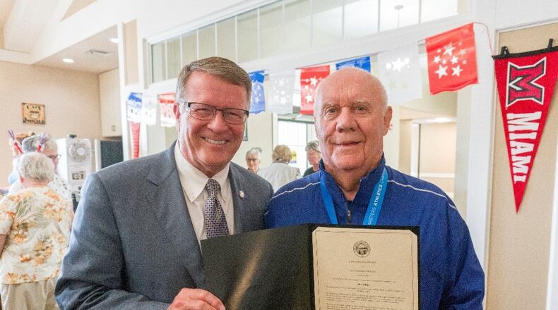 State Senator Steve Wilson presents Otterbein resident Bob Arledge with a Senatorial Citation.