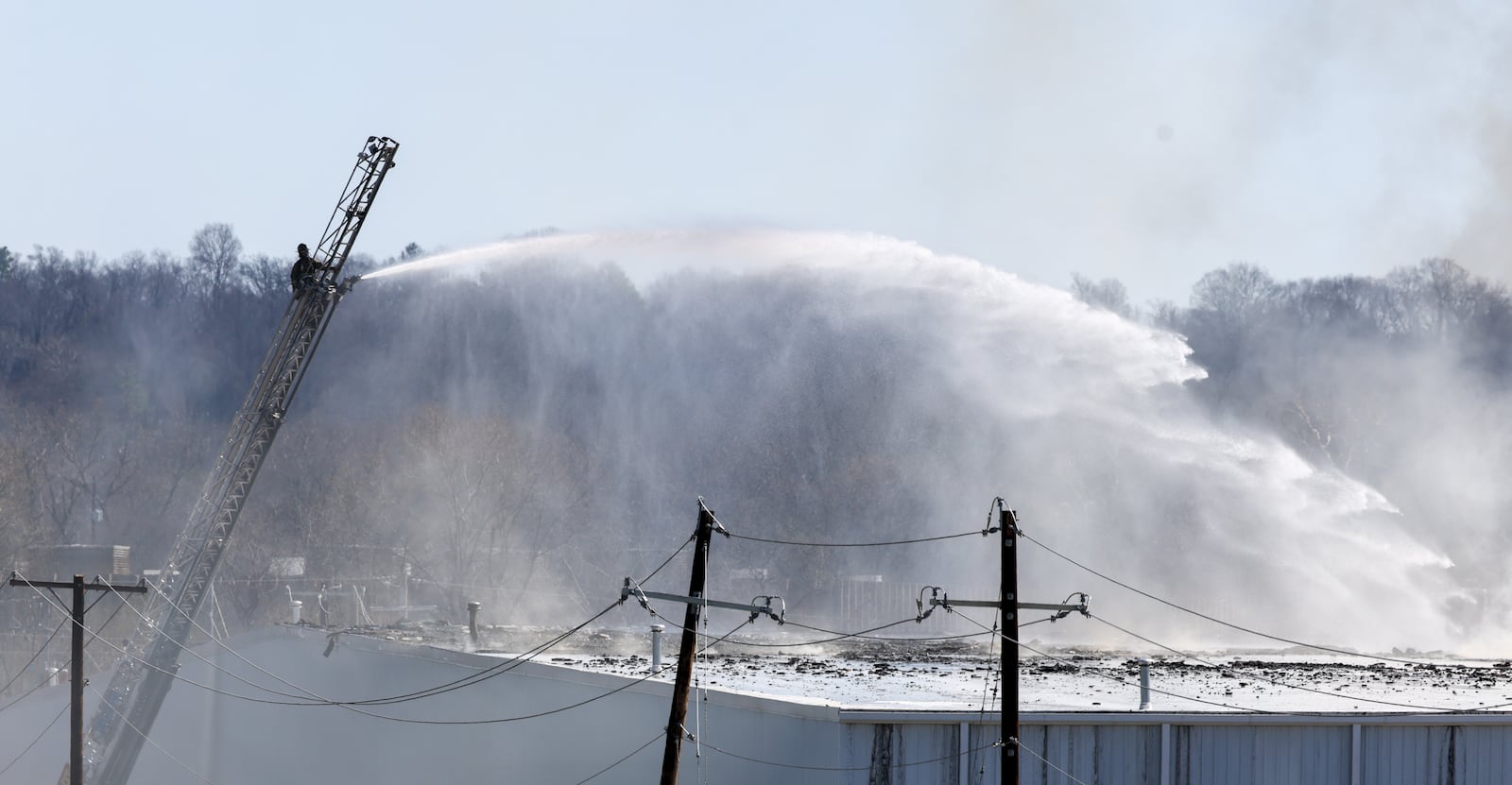 The fire at Fuyao Glass America rekindled shortly before noon on Tuesday, March 24. While firefighters have been working at the site since it first caught fire Sunday night, they had been focusing on hotspots before a large rekindling caused black smoke to rise that was visible for miles. The building that caught fire was Fuyao's coating facility, which was still in the finishing stages of construction. BRYANT BILLING / STAFF