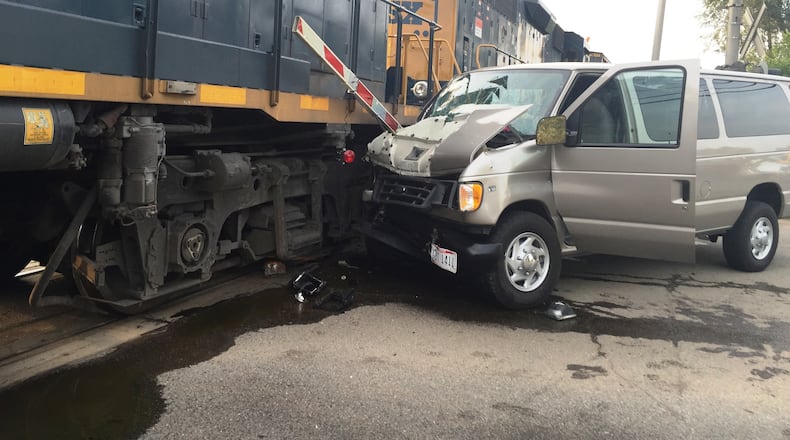 One adult died and as many as nine children were injured in this collision involving a van and a train in Middletown on Tuesday evening, July 28, 2015. (Todd Jackson/Staff)