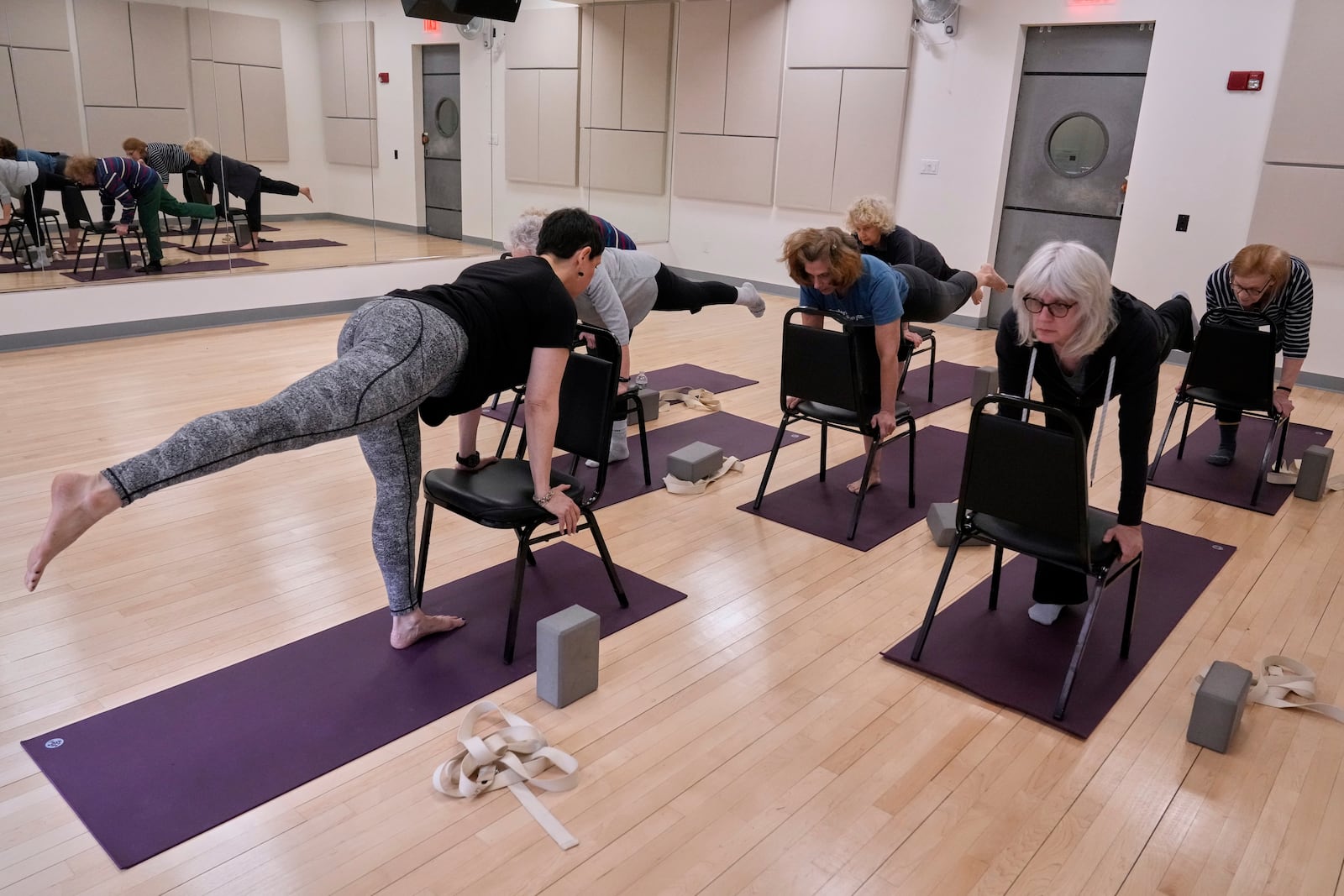 Whitney Chapman, left, conducts a chair yoga class at the Marlene Meyerson JCC Manhattan, in New York, March 28, 2025. (AP Photo/Richard Drew)