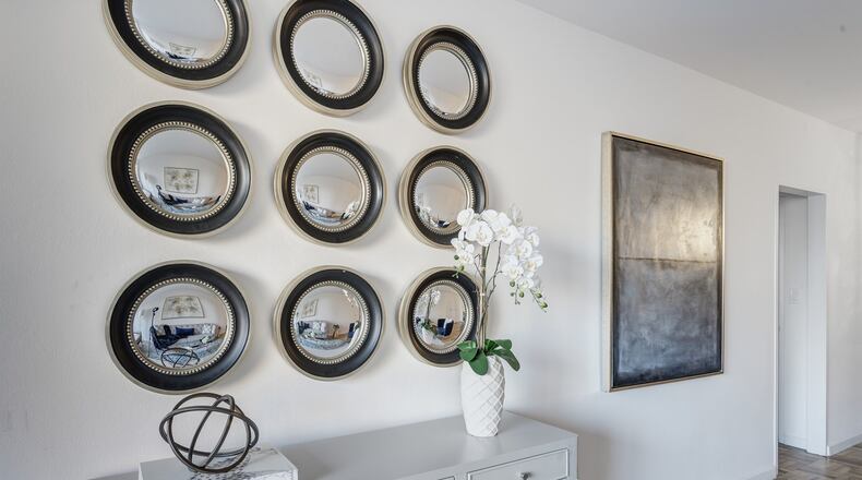 Using mirrors especially in a series is an easy and affordable way to create instant wall decor that is sophisticated at the same time. (Design Recipes)