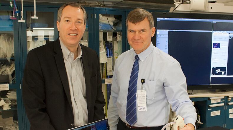 Andrew Cothrel, left, and Dr. Daniel von Allmen, devised a new needle-guilding system that recently won a CincyTech investment. CONTRIBUTED.
