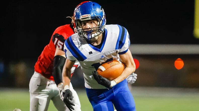 Brookville High School sophomore Dane Moore runs the ball after catching a pass during their game against Milton-Union on Friday, Nov. 11, 2022 at Xenia's Doug Adams Stadium. The Bulldogs won 38-6. CONTRIBUTED PHOTO BY MICHAEL COOPER