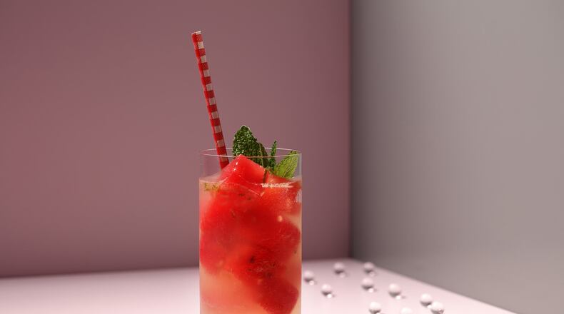 The beauty of watermelon cubes is that they chill your drink without diluting it. Here they give color to a refreshing homemade limeade. (Food styling by Joan Moravek.) (E. Jason Wambsgans/Chicago Tribune/TNS)