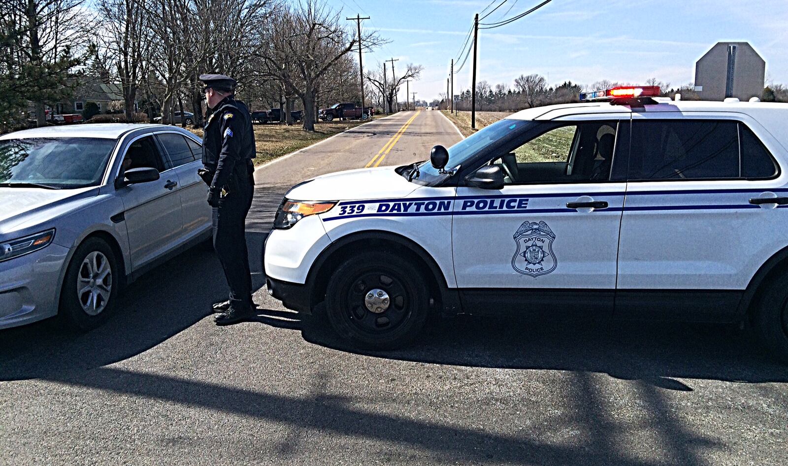 Police are blocking East Westbrook Road near Brookville after a police pursuit ended. The vehicle is believed to have been involved in an earlier shots fired incident in Dayton. (Marshall Gorby/Staff)
