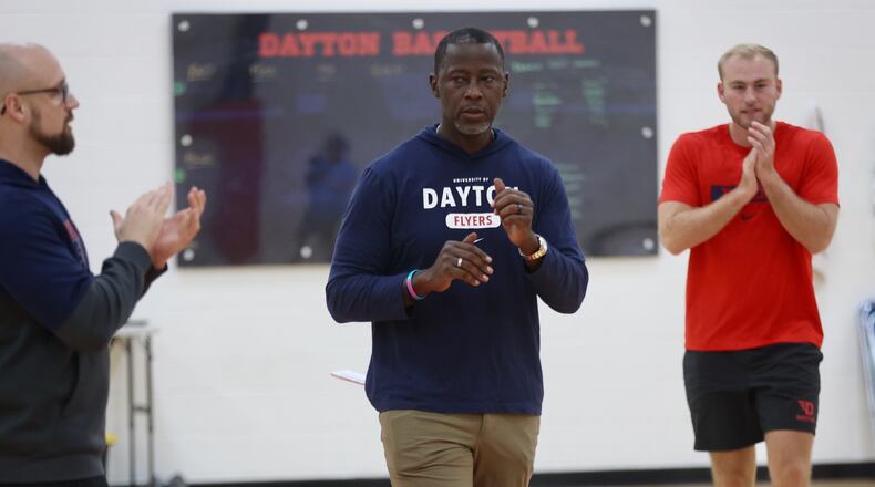 Dayton's Anthony Grant brings the team together for a huddle during a preseason practice on Wednesday, Oct. 2, 2024, at the Cronin Center. David Jablonski/Staff