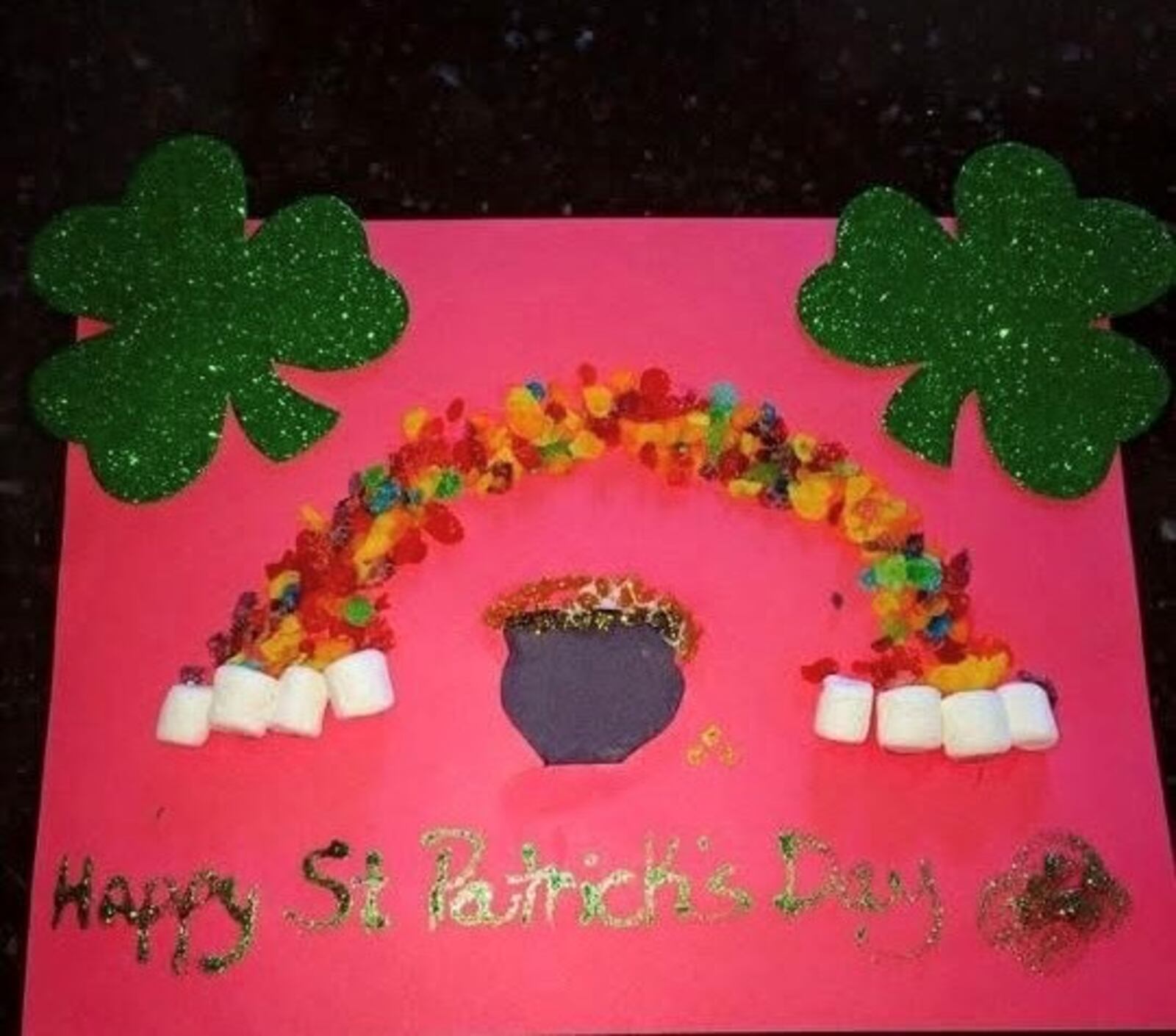 Rainbow craft using Fruity Pebbles and marshmallows for the rainbow. CONTRIBUTED