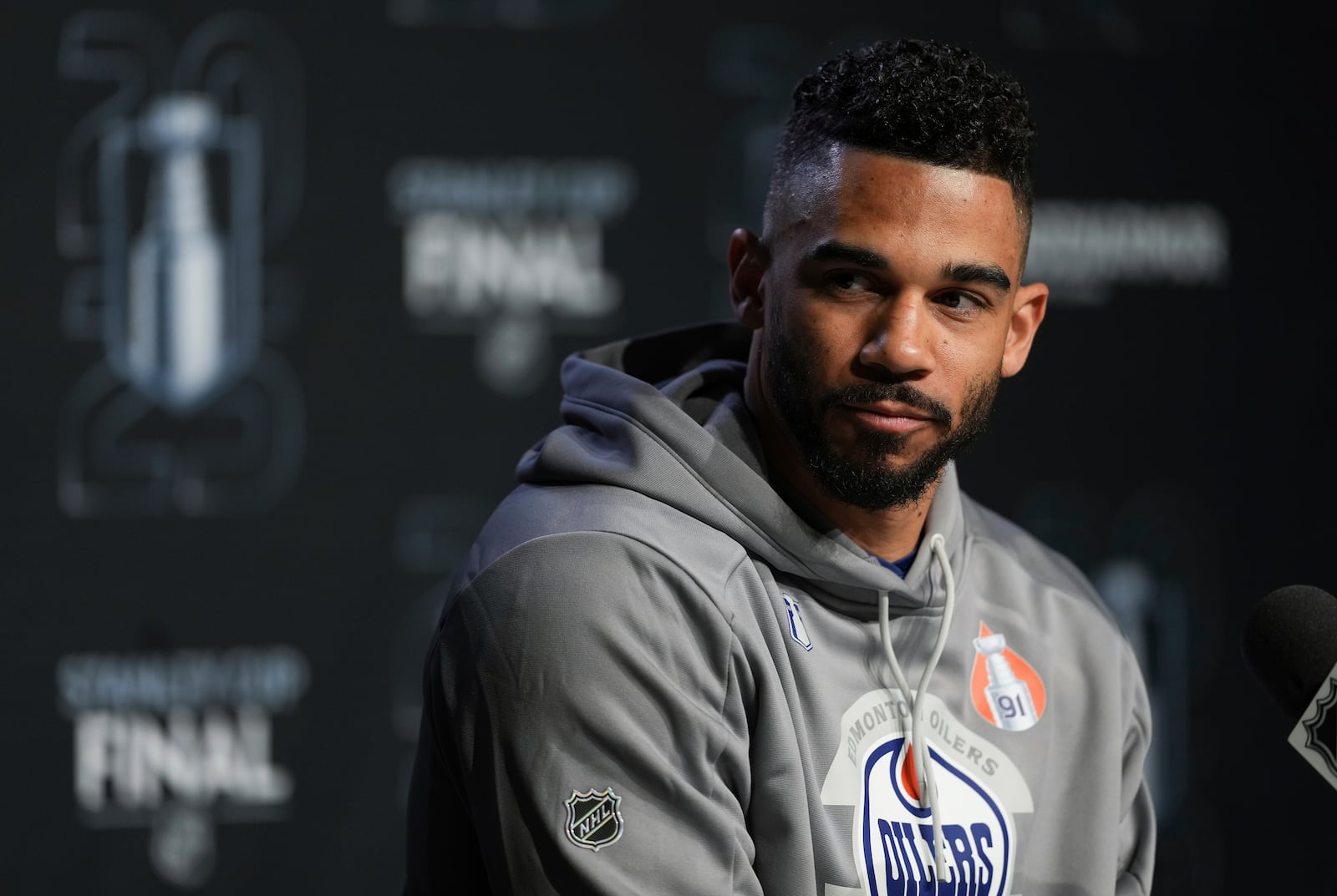 Edmonton Oilers' Evander Kane pauses while speaking during a news conference for the NHL hockey Stanley Cup Finals. Thursday, June 5, 2025, in Edmonton, Alberta. (Darryl Dyck/The Canadian Press via AP)