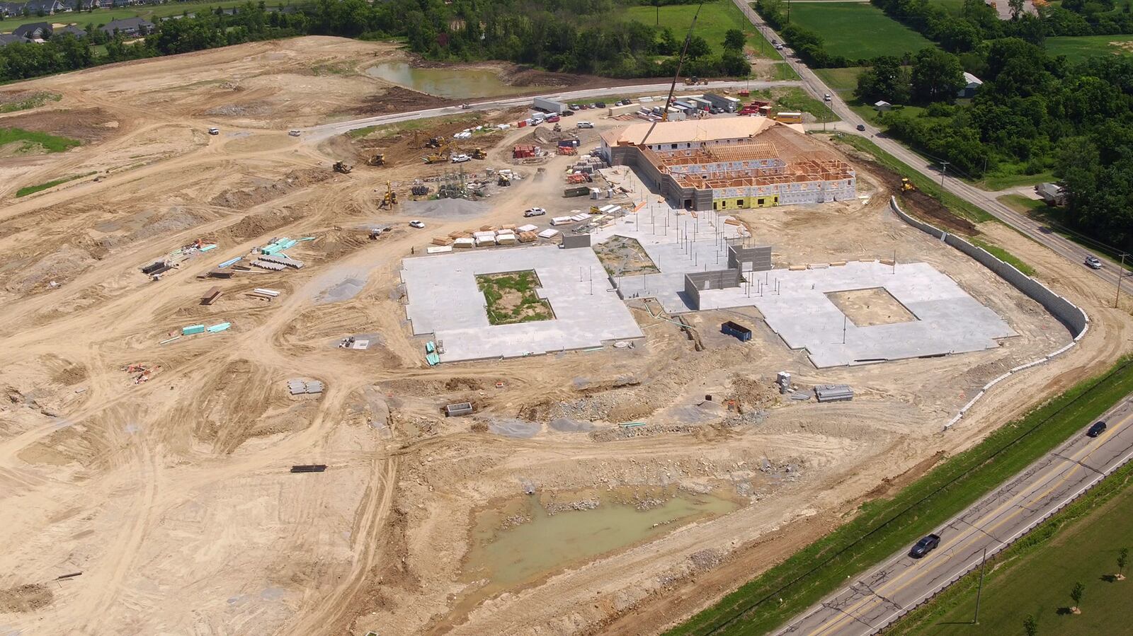 A huge chunk of land in Centerville is being developed for senior housing on the south side of town.  About 70 acres of the former Rabold Farm are being shaped into roads, lots and buildings for the Randall Residence of Centerville and Woodland Greens homesites at a cost of $42 million.  The new buildings currently under construction will house nearly 500 residents including assisted living apartments and memory support apartments with a total of 171,021-square-feet of space.  The balance of the land will be divided into lots for houses.   TY GREENLEES / STAFF