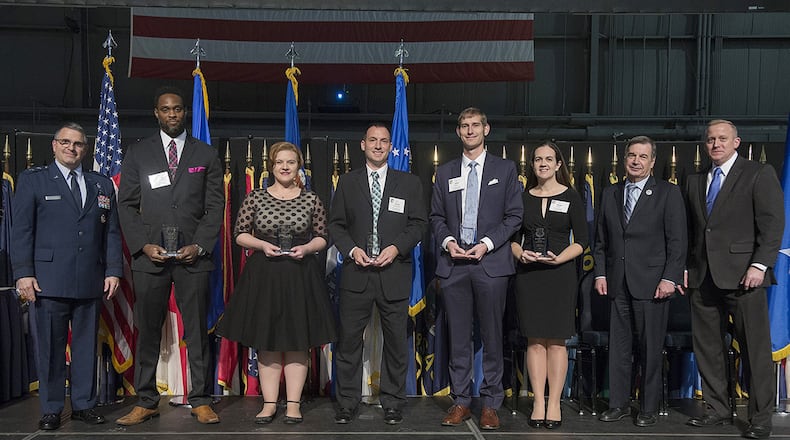 Recipients of the Air Force Research Laboratory Science and Engineering Early Career Award pose with Maj. Gen. William Cooley, AFRL commander, and Dr. Morley O. Stone, AFRL chief technology officer, during the AFRL Fellows and Early Career Awards Ceremony Oct. 26, 2017, at the National Museum of the Air Force, Wright-Patterson Air Force Base, Ohio. The award recognizes young scientists and engineers for exceptional leadership potential and mission contributions early in their research careers. (U.S. Air Force photo by R.J. Oriez)