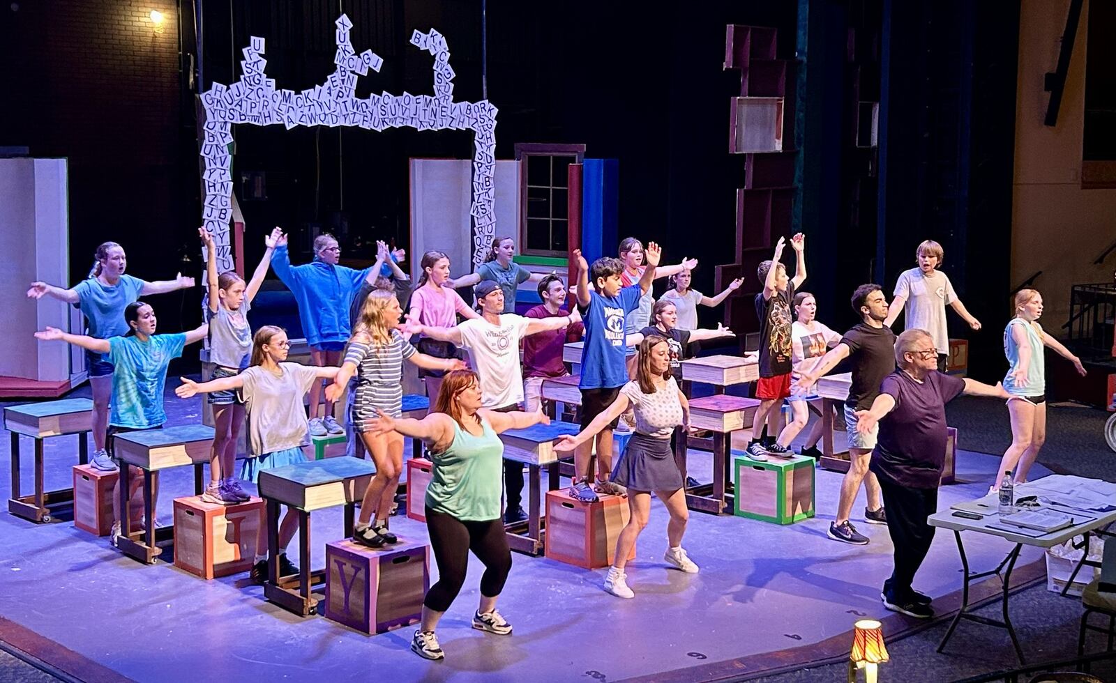 La Comedia Dinner Theatre Artistic Director Chris Beiser leads the cast of "Matilda: The Musical" in rehearsal. FACEBOOK PHOTO