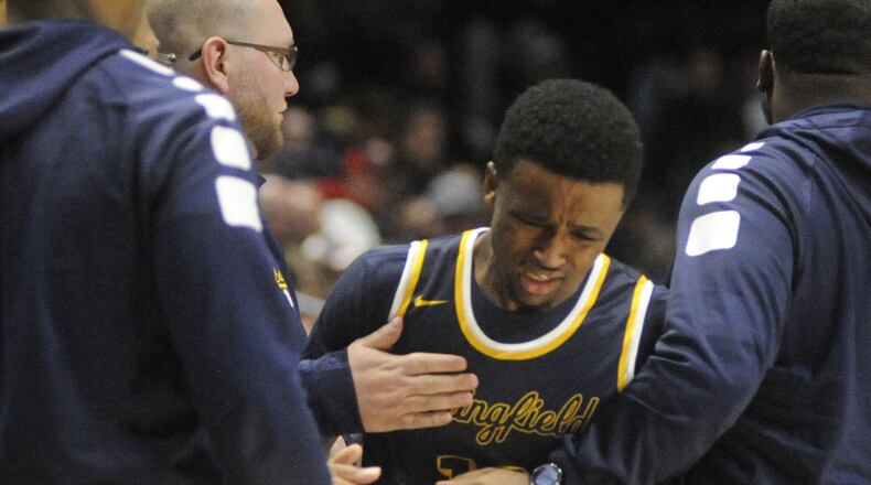 Springfield senior Michael Wallace takes a hard loss. Moeller defeated Springfield 65-44 in a boys high school basketball D-I regional semifinal at Xavier University’s Cintas Center in Cincinnati on Wednesday, March 14, 2018. MARC PENDLETON / STAFF
