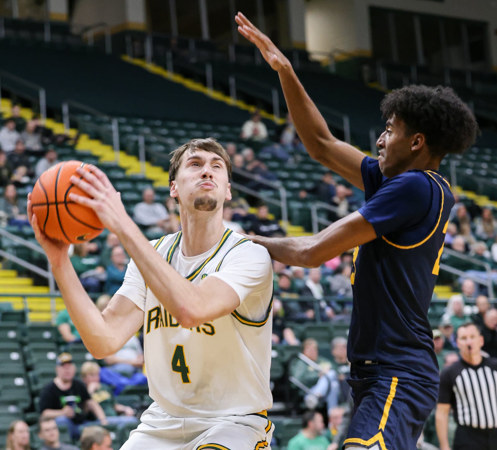 Wright State freshman forward Kellen Pickett shoots with pressure from Franklin College's Dylan Beverly during a nonconference game on Monday, Nov. 3 at Ervin J. Nutter Center in Fairborn. Pickett scored seven points and had five rebounds and three assists. BRYANT BILLING/STAFF