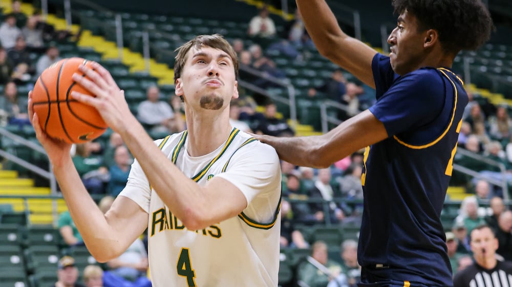 Wright State freshman forward Kellen Pickett shoots with pressure from Franklin College's Dylan Beverly during a nonconference game on Monday, Nov. 3 at Ervin J. Nutter Center in Fairborn. Pickett scored seven points and had five rebounds and three assists. BRYANT BILLING/STAFF