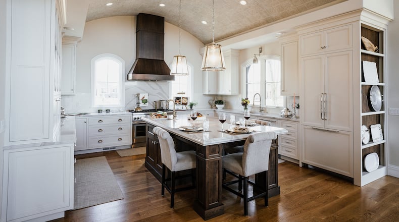 The Wakers' gourmet-style kitchen is open to the great room, and the large island is perfect for family gatherings and entertaining. It features a barrel-tile ceiling that was hand-placed by Ed and high school friend Jeff Duke. CONTRIBUTED PHOTOS