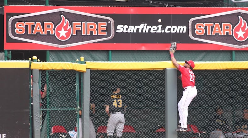 Reds center fielder Phillip Ervin can’t get to a home run hit by he Pirates on Sunday, July 22, 2018, at Great American Ball Park in Cincinnati. David Jablonski/Staff
