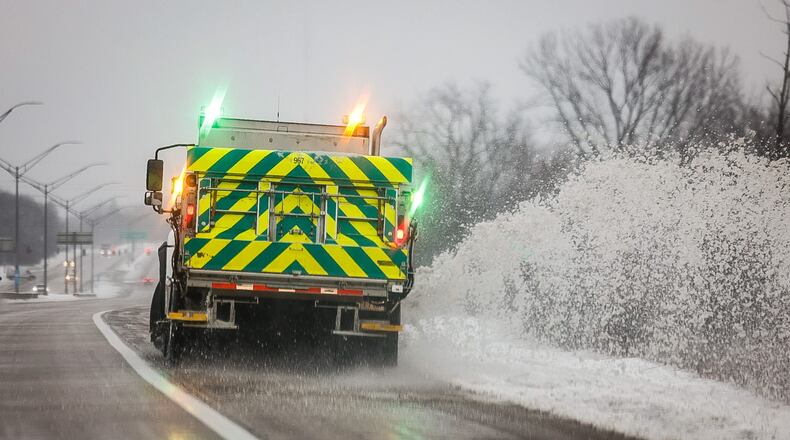 A snowplow pushes snow off Ohio 35 near Dayton Wednesday morning January 25, 2023. The 5 inches of snow that fell in Dayton on Wednesday broke a daily snowfall record for the day of 4.9 inches set in 1915, according to the National Weather Service. JIM NOELKER/STAFF
