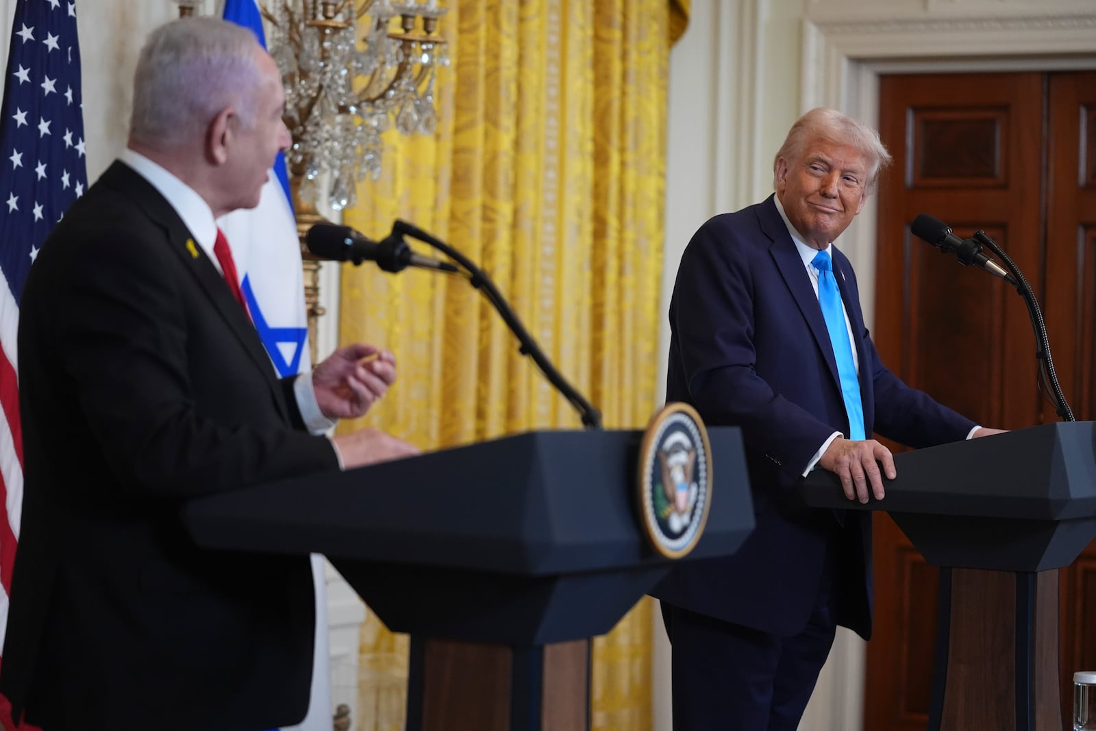 FILE - President Donald Trump listens as Israel's Prime Minister Benjamin Netanyahu speaks during a news conference in the East Room of the White House, Feb. 4, 2025, in Washington. (AP Photo/Evan Vucci, File)