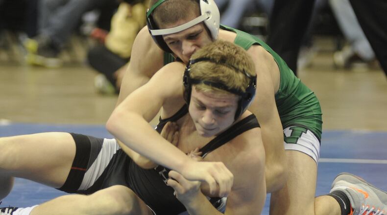 Graham’s Jeffrey Thomas (front) won the 113-pound final of the GMVWA Holiday Wrestling Tournament at WSU’s Nutter Center as a freshman. MARC PENDLETON / STAFF