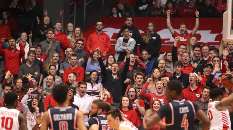 Fans in the Dayton student section cheer after a missed free throw by Richmond on Sunday, Jan. 6, 2019, at UD Arena. David Jablonski/Staff