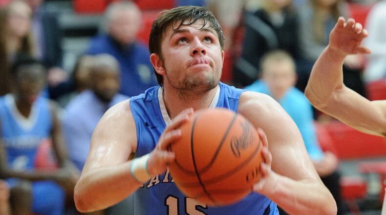 Fairborn senior center Jacob Webb shoots during a Division I sectional quarterfinal against Troy on Friday at Trotwood. BRYANT BILLING / CONTRIBUTED