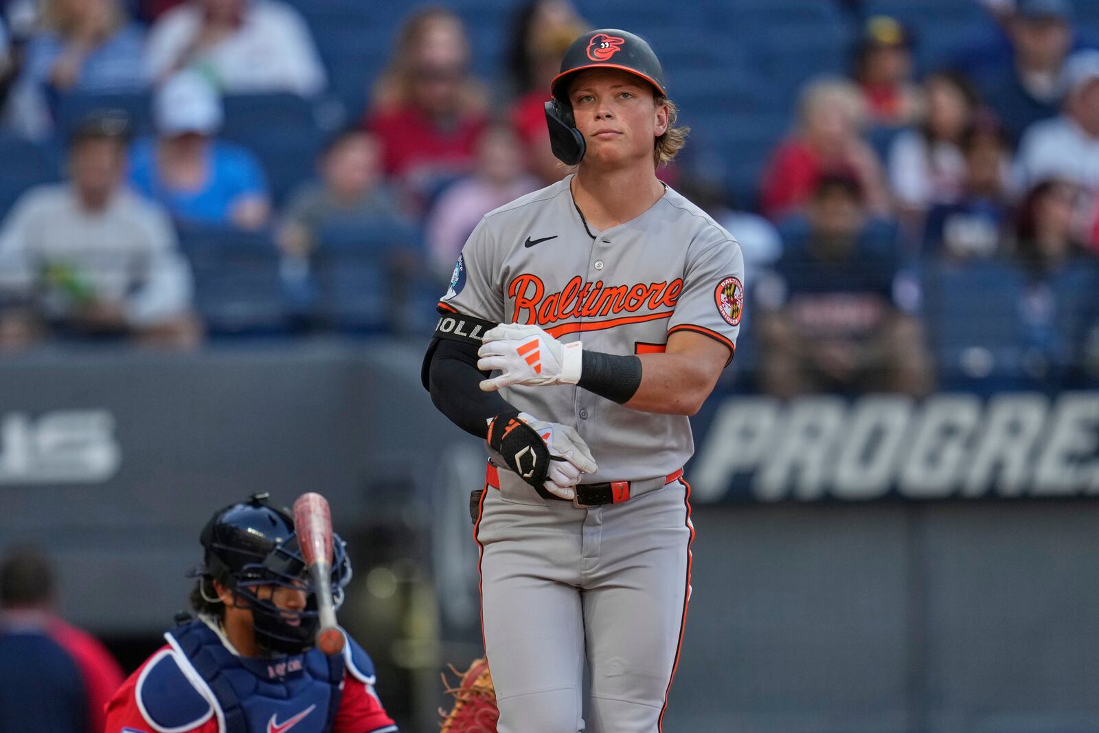 Baltimore Orioles' Jackson Holliday tosses his bat as he is walked in the third inning of a baseball game against the Cleveland Guardians in Cleveland, Tuesday, July 22, 2025. (AP Photo/Sue Ogrocki)