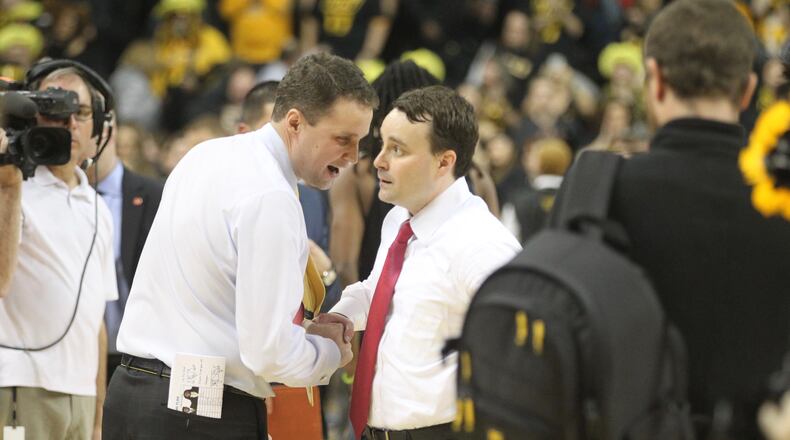 Dayton’s Archie Miller, right, and Virginia Commonwealth’s Will Wade talk after a game on Friday, Jan. 27, 2017, at UD Arena. David Jablonski/Staff