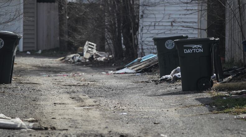 Police continue to investigate what led to a Darke County teenager found in an alley on South Erwin St. in Dayton last month and who later died. JIM NOELKER/STAFF