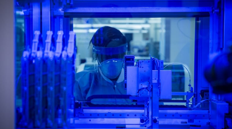 Staff Sgt. Alexis Shodeke, a medical laboratory technician in the U.S. Air Force School of Aerospace Medicine’s Epidemiology Laboratory, observes as new samples are tested for COVID-19 in June. The Epi Lab is the sole clinical reference lab in the Air Force, and USAFSAM is part of AFRL’s 711th Human Performance Wing headquartered at Wright-Patterson Air Force Base. (U.S. Air Force photo by Richard Eldridge)