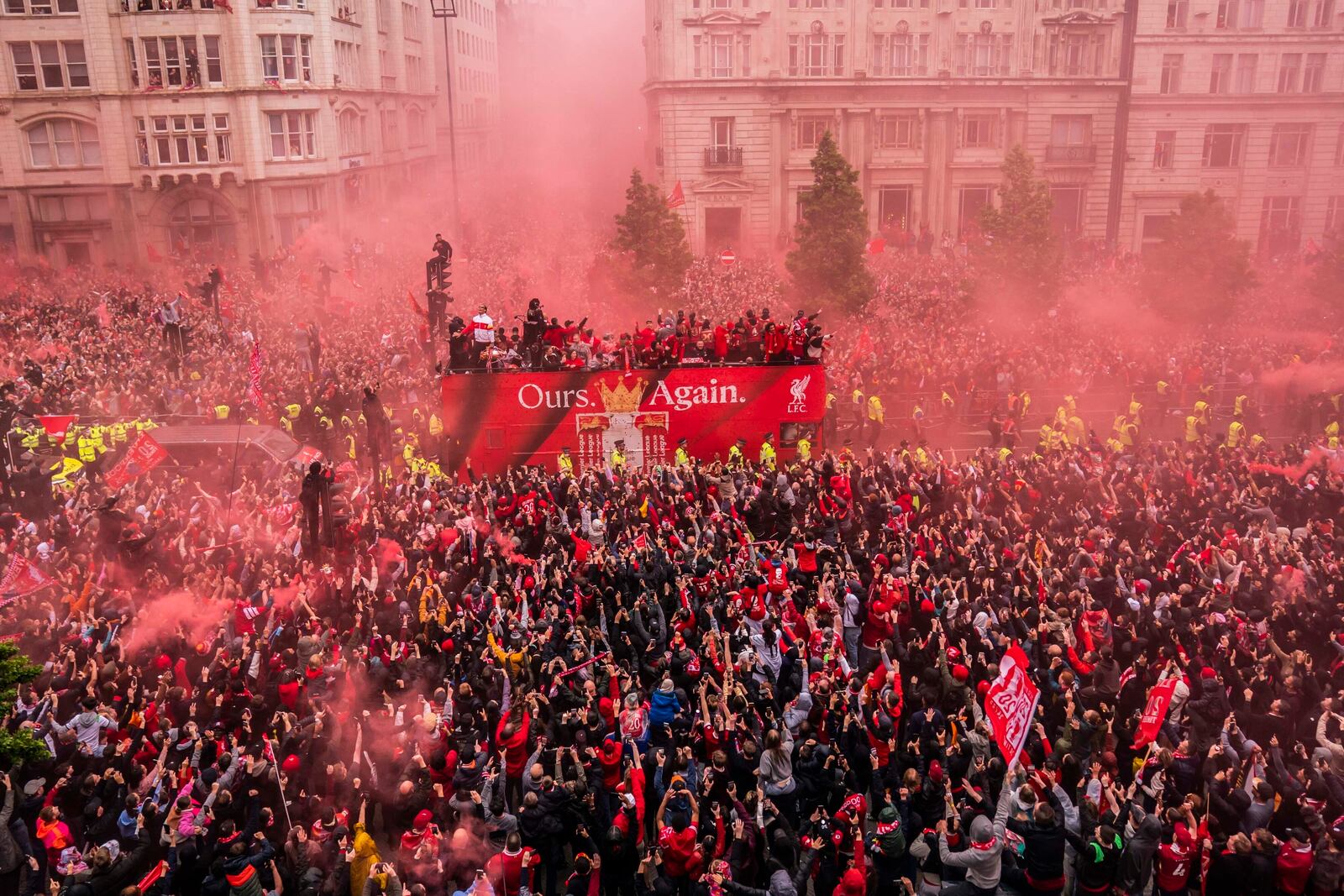 Crowds greet the Liverpool soccer team during their Premier League winners parade in Liverpool, England, Monday, May 26, 2025. (Owen Humphreys/PA via AP)