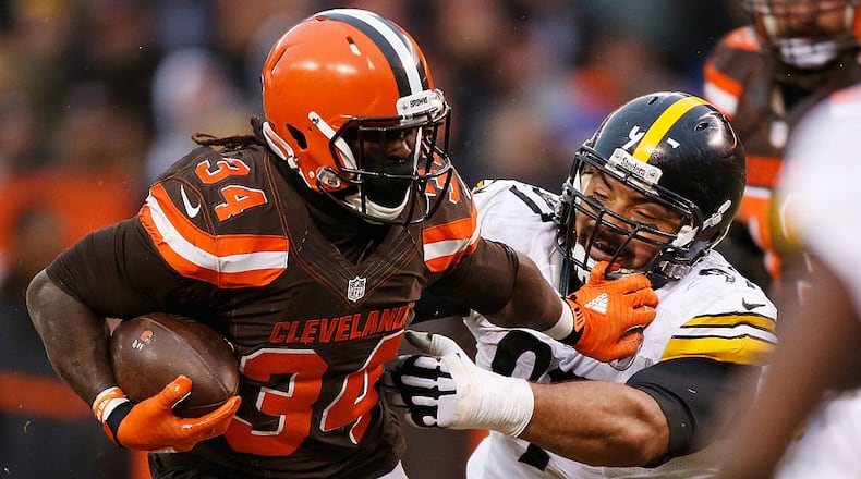 CLEVELAND, OH - JANUARY 3: Isaiah Crowell #34 of the Cleveland Browns stiff arms Cameron Heyward #97 of the Pittsburgh Steelers during the third quarter at FirstEnergy Stadium on January 3, 2016 in Cleveland, Ohio. (Photo by Gregory Shamus/Getty Images)