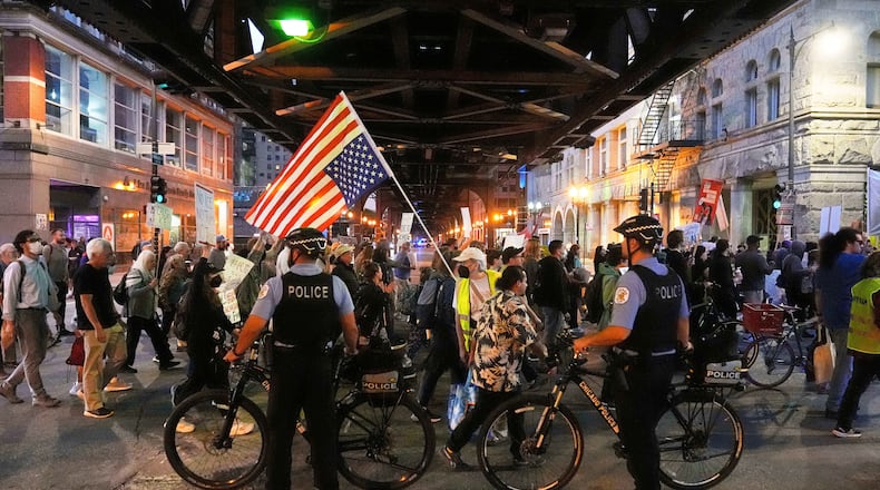 FILE - Police officers block a street as demonstrators march at a protest opposing "Operation Midway Blitz" and the presence of ICE, Sept. 9, 2025, in Chicago. (AP Photo/Erin Hooley, File)