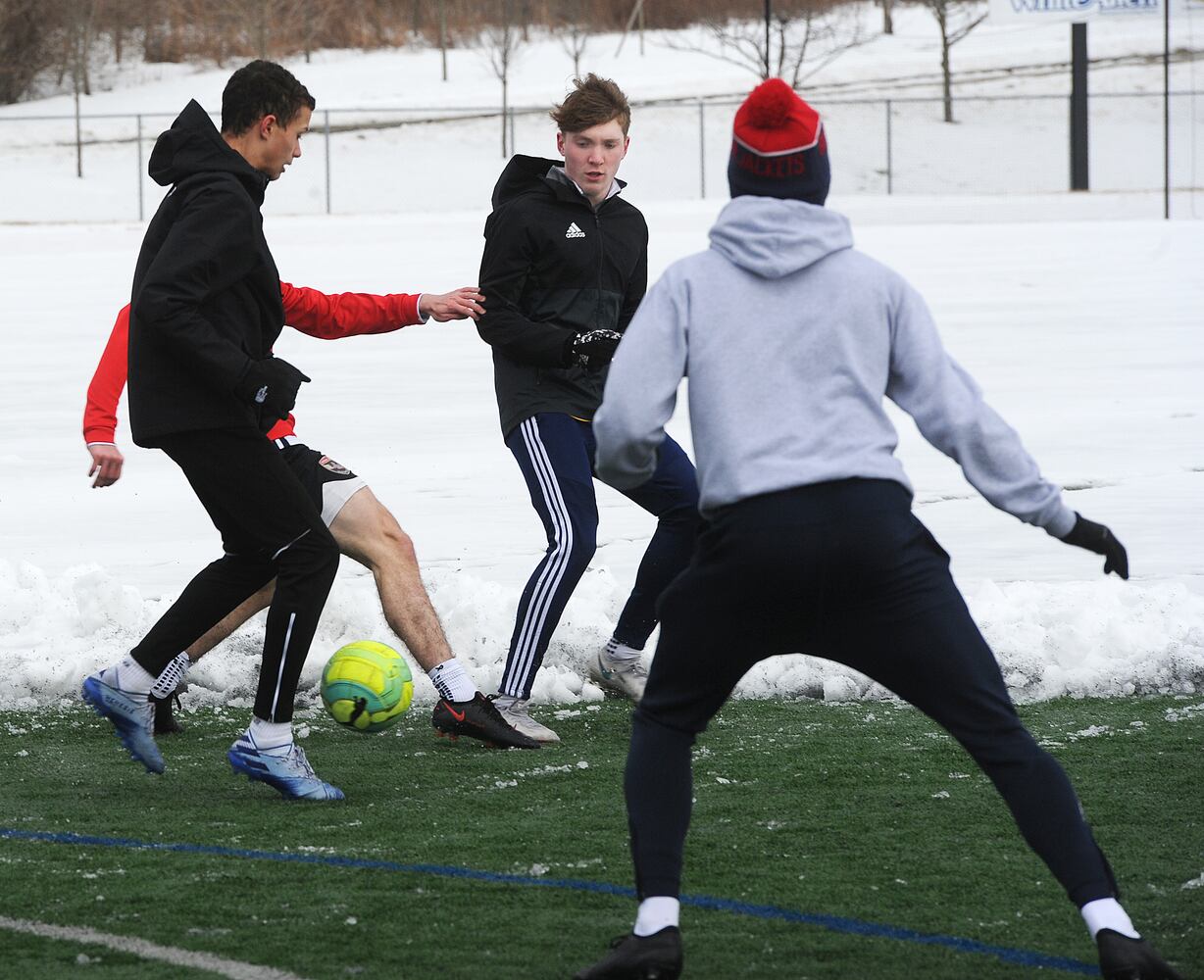 PHOTOS: Oakwood soccer players shovel snow to play