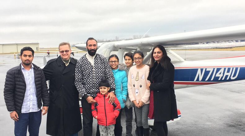 Paviter Singh and his family pictured here with Wings of Hope President and CEO Bret Heinrich Dec. 23 at the Greene County-Lewis A. Jackson Regional Airport. Contributed