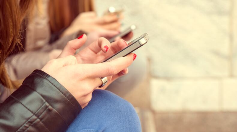 Local experts say that parents need to talk more to their children when it comes to being safe using various cellphone apps. FILE PHOTO