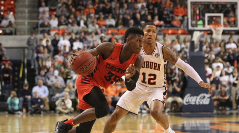 Dayton’s Dwayne Cohill drives to the basket against Auburns JVon McCormick on Saturday, Dec. 8, 2018, at Auburn Arena in Auburn, Ala. David Jablonski/Staff