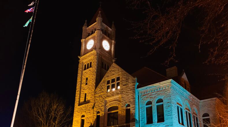 Greene County courthouse lit up in the blue and yellow of the Ukrainian flag, the latest local government to do so in support of the European country. LONDON BISHOP/STAFF