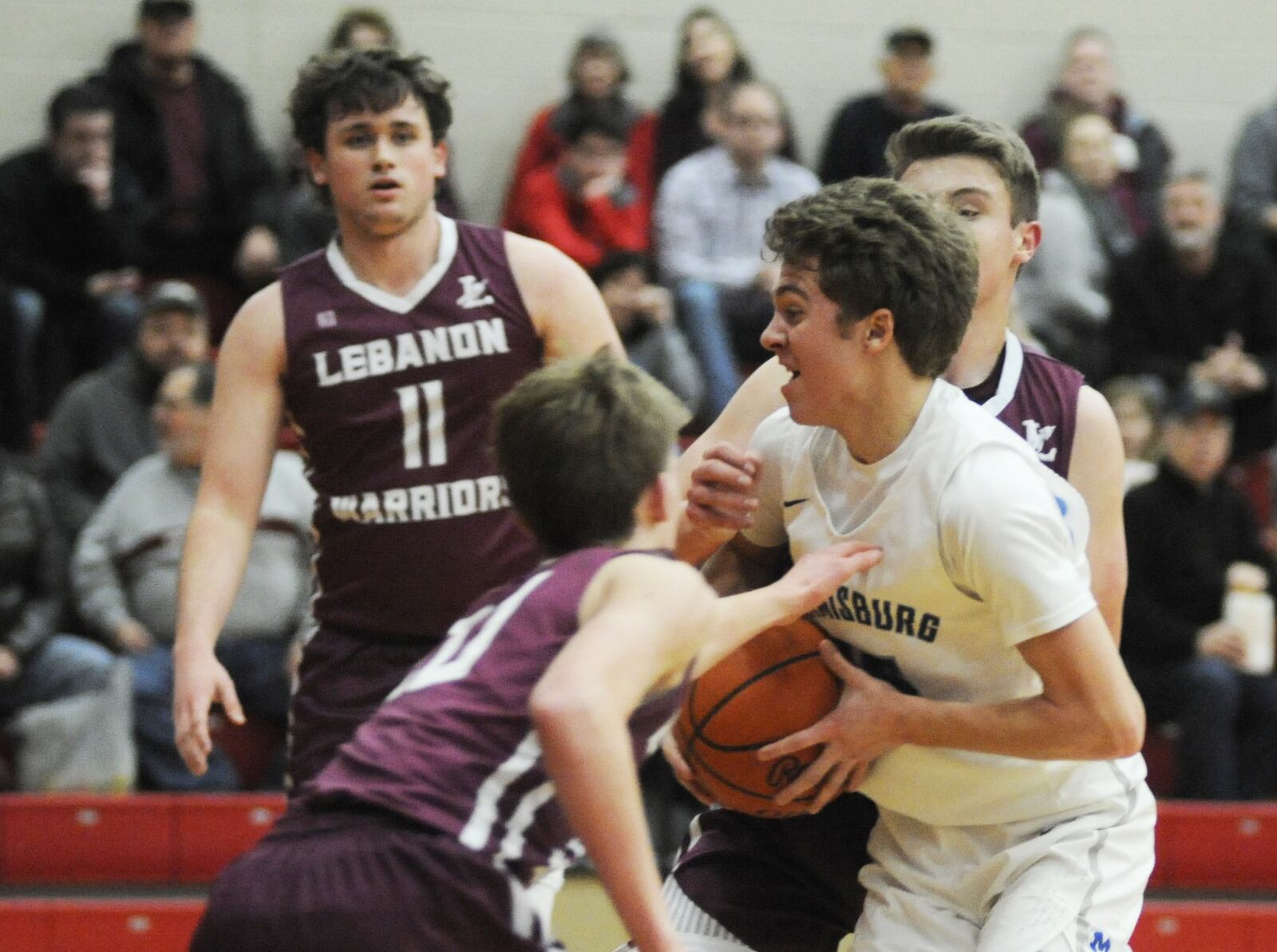 Alex Ball of Miamisburg (with ball) draws three Lebanon defenders. Miamisburg defeated Lebanon 60-51 in a boys D-I first-round sectional game at Trotwood-Madison on Friday, Feb. 22, 2019. MARC PENDLETON / STAFF