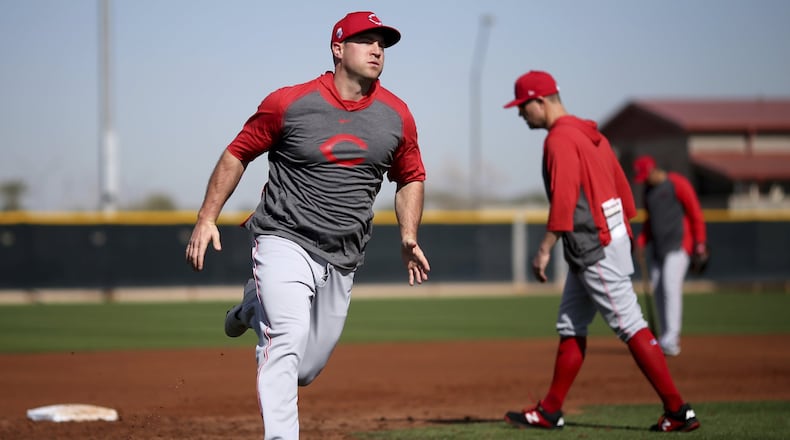 Cincinnati Reds right fielder Scott Schebler runs the bases during baseball spring training Wednesday, Feb. 19, 2020, in Goodyear, Ariz. (Kareem Elgazzar/The Cincinnati Enquirer via AP)