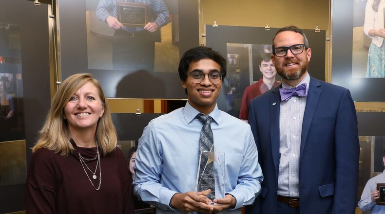 The Warren County ESC Governing Board has named Amogh Iyanna, center, as the county's Overall 2021 Top Academic Recipient of the Franklin B. Walter All Scholastic Award. Each Warren County school district nominated their top academic students and the Warren County ESC Governing Board selected the top student. Iyanna is flanked by his mentor, Dee Dee Messer, left, a Mason High School teacher, and Mason Superintendent Jonathan Cooper, right. CONTRIBUTED/WARREN COUNTY ESC.
