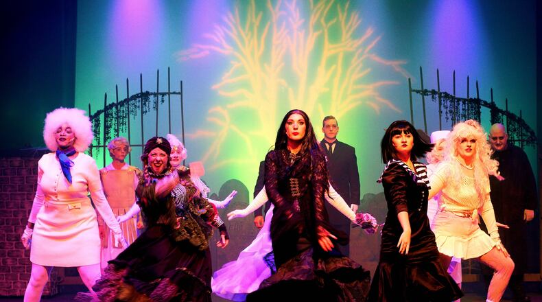 Center left to right: Kelli Myers (Grandma), Taylor Nelson (Morticia) and Brianna Wolfe (Wednesday) and the cast of Dayton Playhouse's production of "The Addams Family." Photo by Ray Geiger
