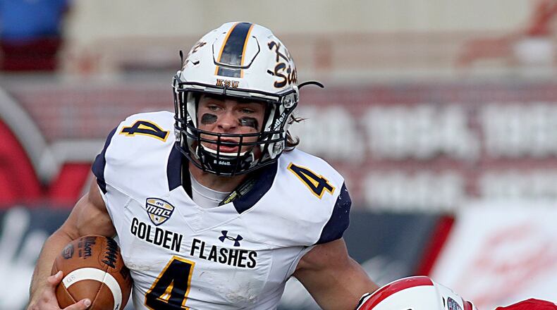 Contributed Photo by E.L. Hubbard Kent State quarterback Nick Holley tries to elude Miami safety Josh Allen during their game at Yager Stadium in Oxford Saturday, Oct. 15, 2016.