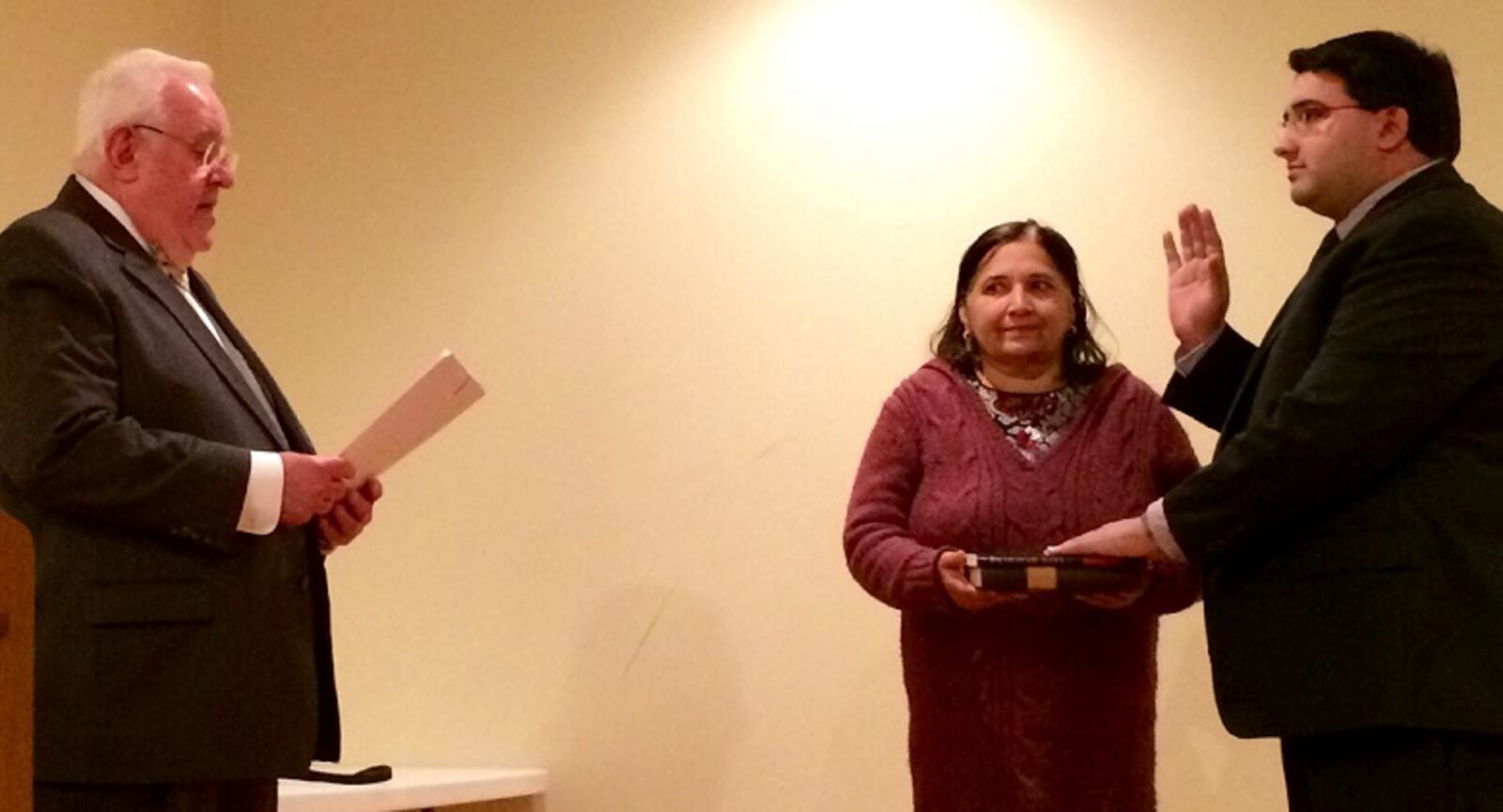 State Rep. Niraj Antani, right, is ceremoniously sworn in on Monday by Miamisburg Mayor Dick Church.