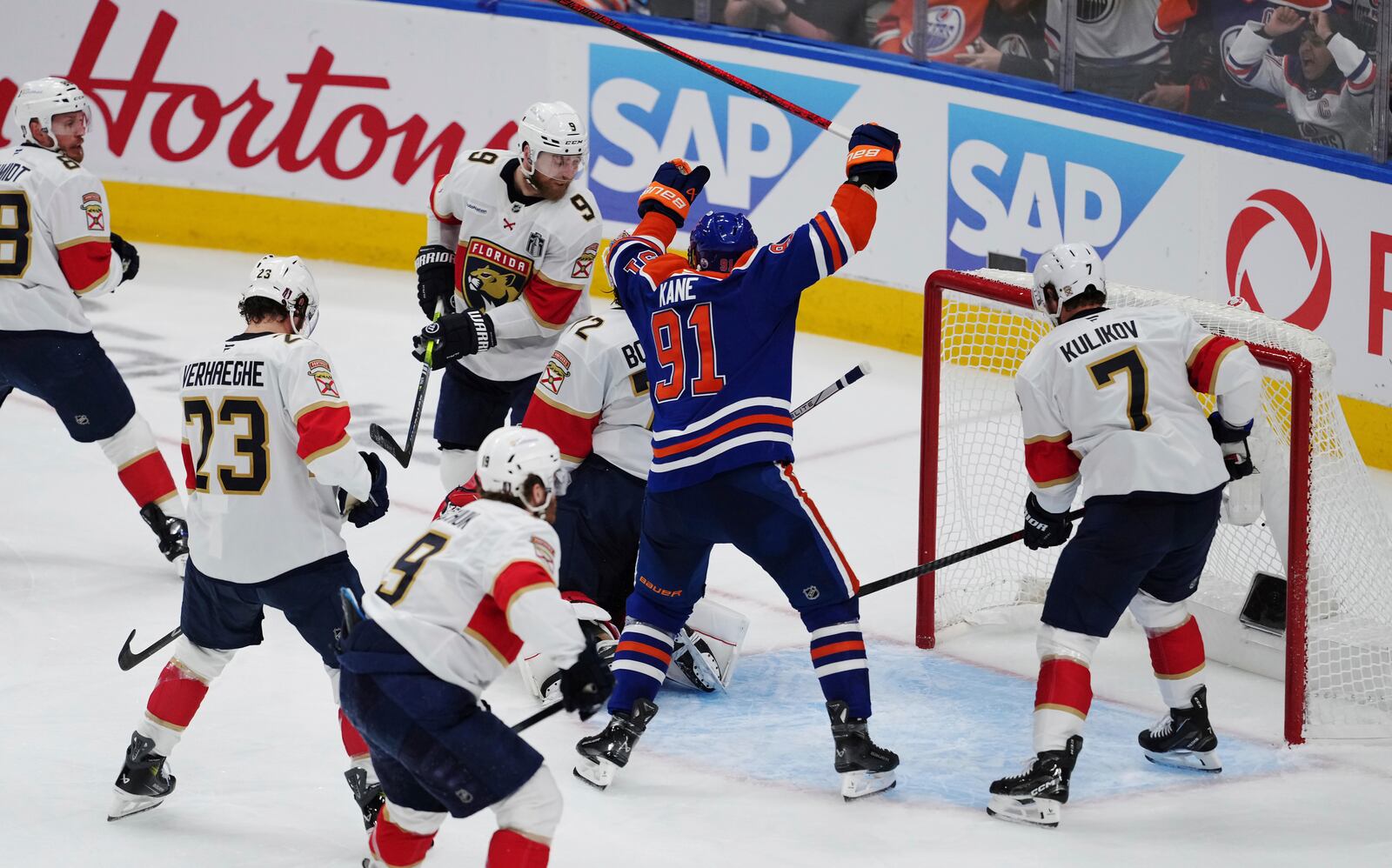 Edmonton Oilers' Evander Kane (91) celebrates Mattias Ekholm's (not shown) goal against Florida Panthers goalie Sergei Bobrovsky (72) during the third period in Game 1 of the NHL Stanley Cup Final, in Edmonton, on Wednesday, June 4, 2025. (Darryl Dyck/The Canadian Press via AP)