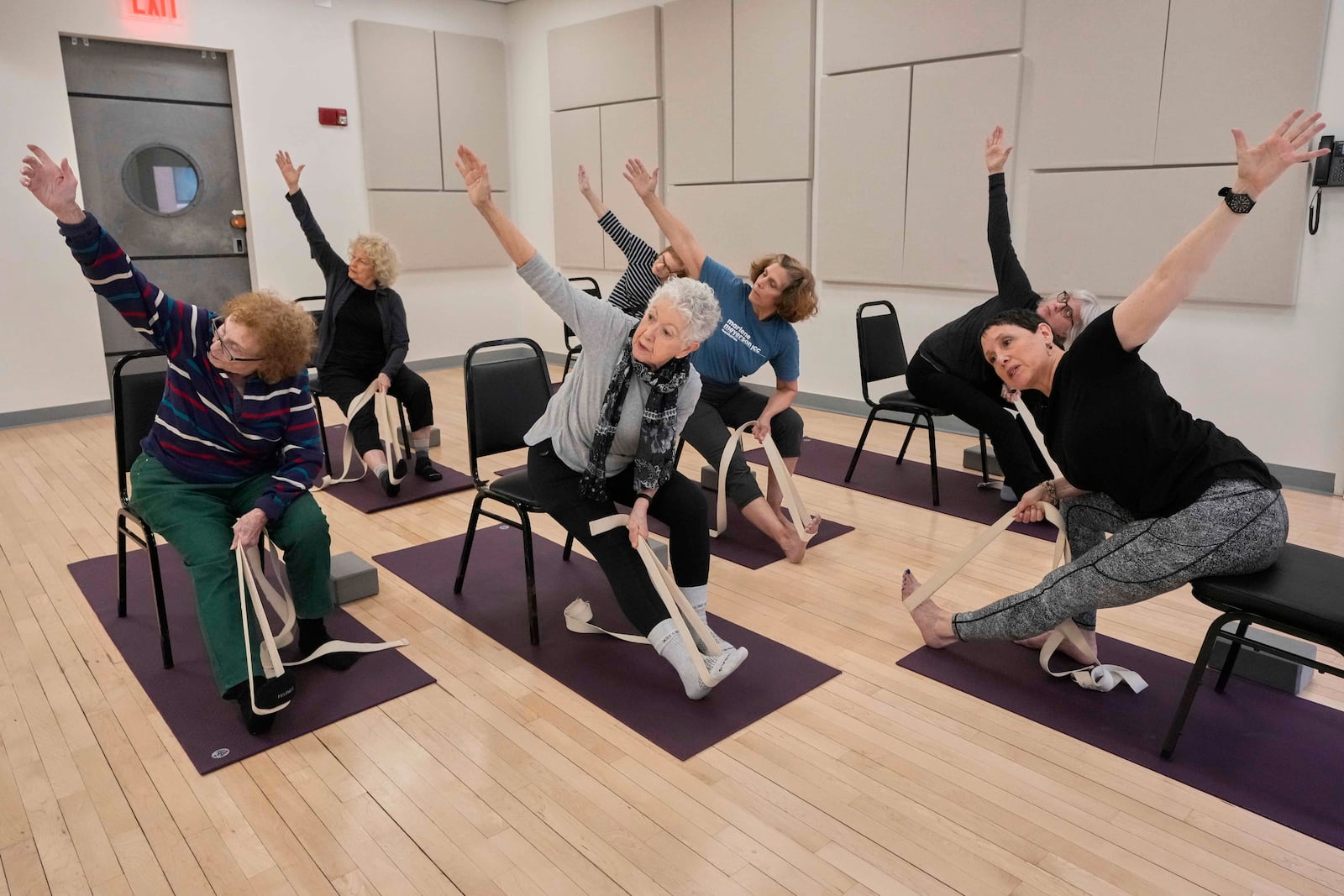 Whitney Chapman, right, conducts a chair yoga class at the Marlene Meyerson JCC Manhattan, in New York, March 28, 2025. (AP Photo/Richard Drew)