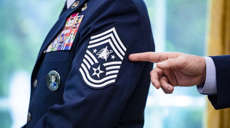 The newly designed rank insignia of U.S. Air Force Space Command, Chief Master Sgt. Roger Towberman, is pointed to. (Samuel Corum /The New York Times)