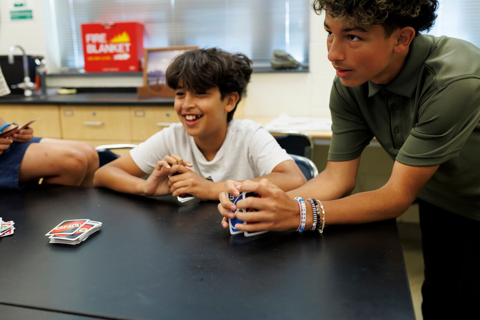 Attendees of LASOS summer camp play a game of Uno at Bel Air High School in Bel Air, Md., on Thursday, July 24, 2025. (AP Photo/KT Kanazawich)