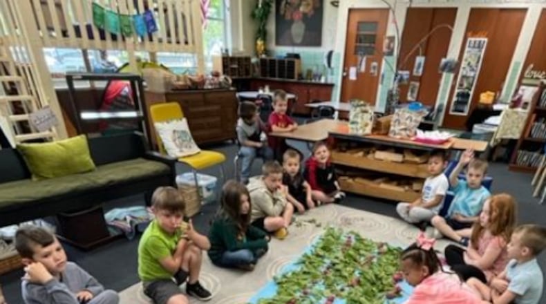 Southdale Elementary students harvest and count the radishes they grew at their school garden. CONTRIBUTED